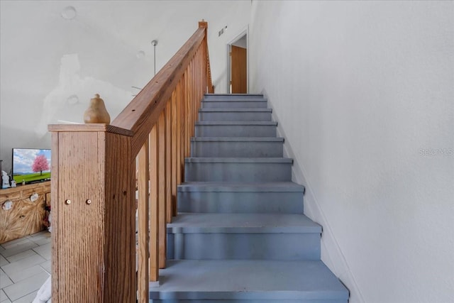 staircase with tile patterned flooring