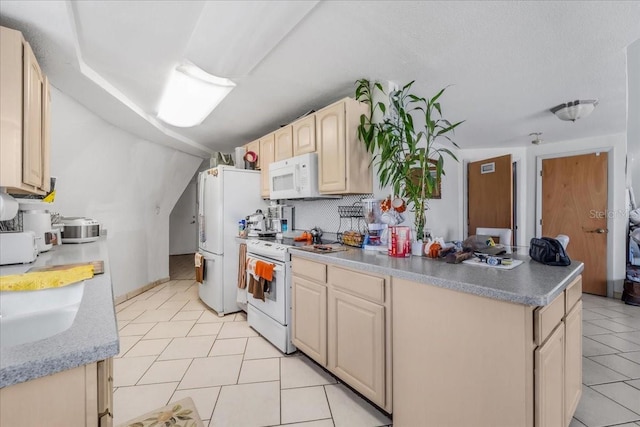 kitchen with white appliances and light tile patterned floors