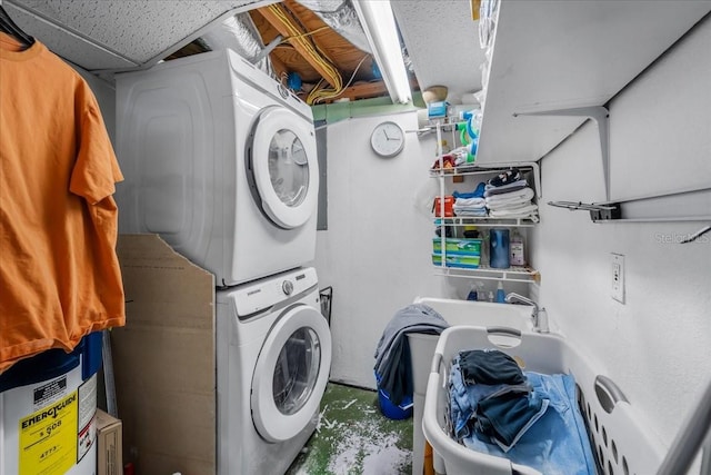 washroom featuring stacked washer and dryer