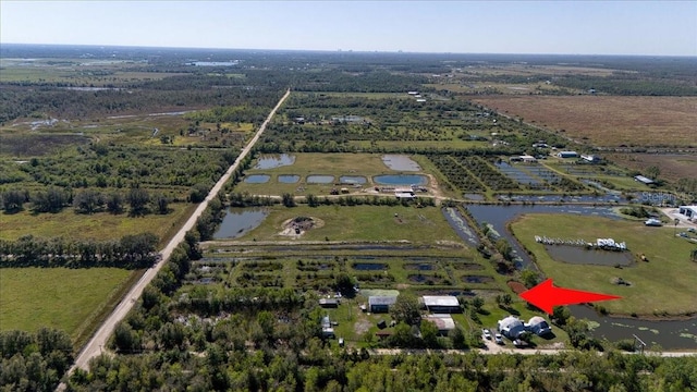 bird's eye view with a rural view and a water view