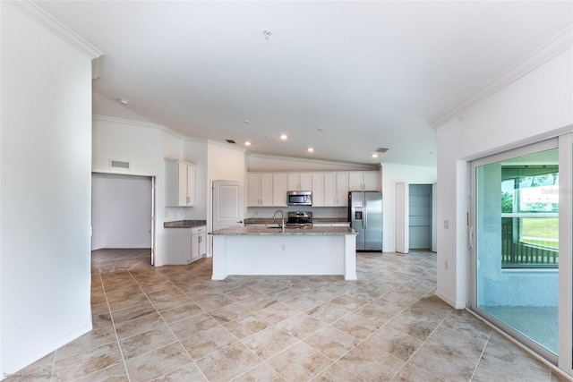 kitchen with ornamental molding, stainless steel appliances, a kitchen island with sink, and vaulted ceiling