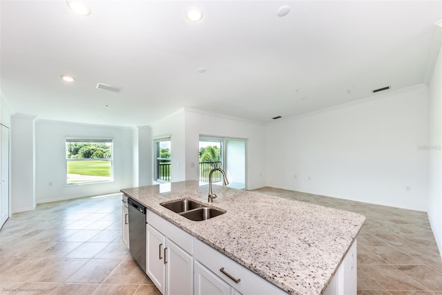 kitchen featuring stainless steel dishwasher, a wealth of natural light, sink, white cabinetry, and an island with sink