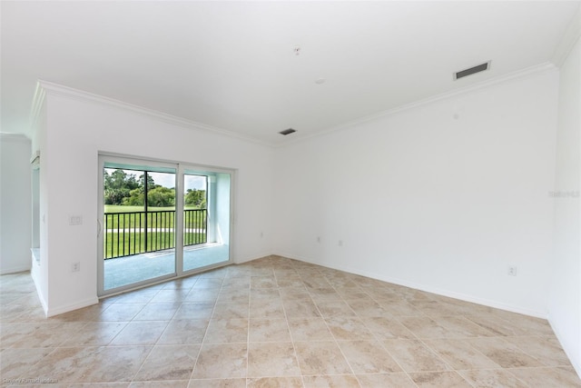 empty room featuring light tile patterned flooring and ornamental molding