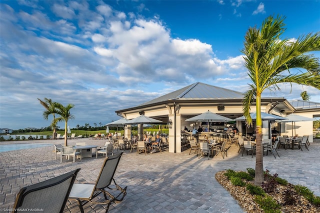 view of patio with a water view