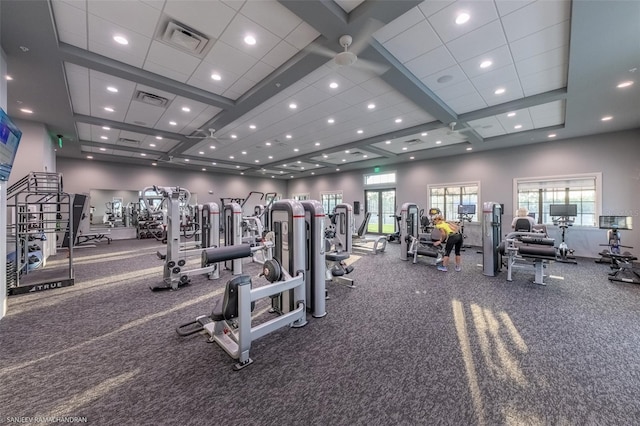 gym featuring plenty of natural light and coffered ceiling