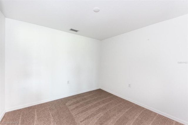 spare room with carpet flooring