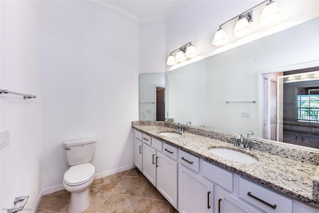 bathroom featuring tile patterned flooring, vanity, toilet, and crown molding