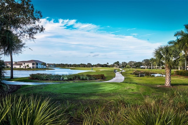 surrounding community featuring a yard and a water view