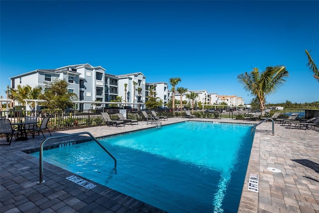 view of swimming pool featuring a patio area