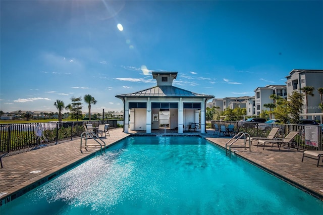 view of swimming pool with a patio