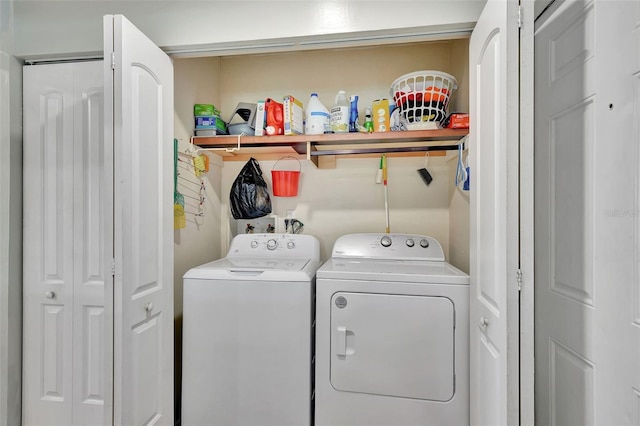 clothes washing area with washer and dryer