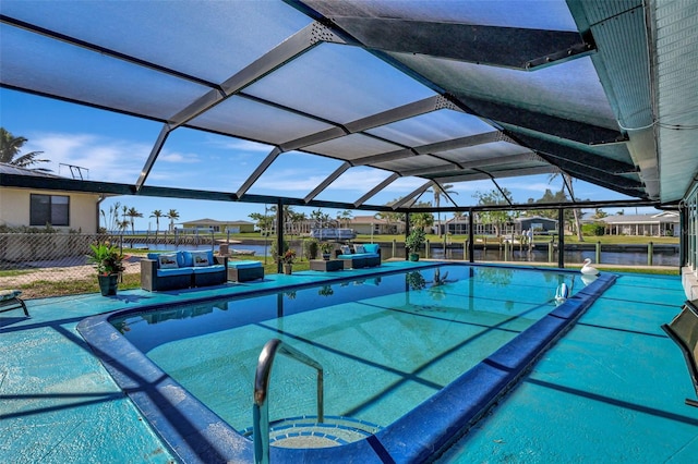 view of pool with a lanai and a water view