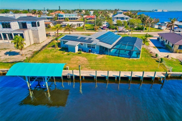 birds eye view of property featuring a water view