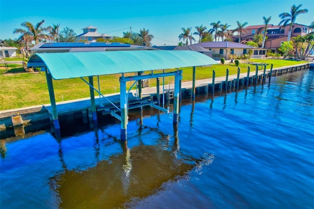 dock area featuring a yard and a water view