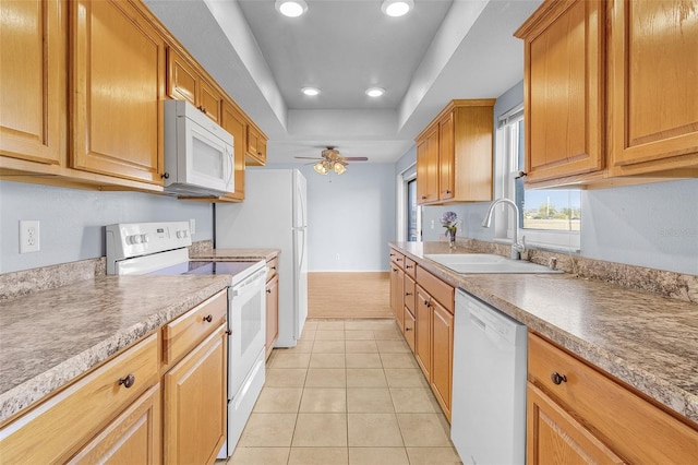 kitchen with light tile patterned floors, white appliances, ceiling fan, and sink