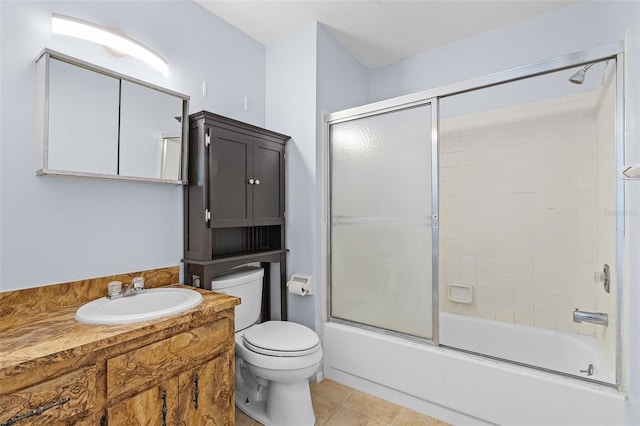 full bathroom featuring tile patterned flooring, vanity, enclosed tub / shower combo, and toilet