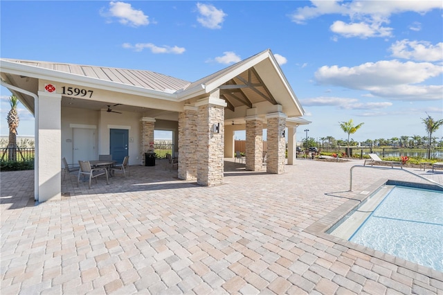 exterior space featuring ceiling fan and a patio area