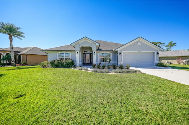 ranch-style home featuring a front lawn and a garage