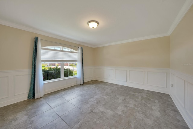 empty room featuring crown molding