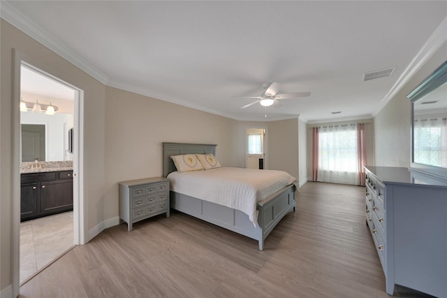 bedroom with light wood-type flooring, ensuite bathroom, ceiling fan, and ornamental molding