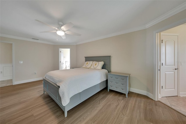 bedroom with ceiling fan, light hardwood / wood-style floors, and ornamental molding