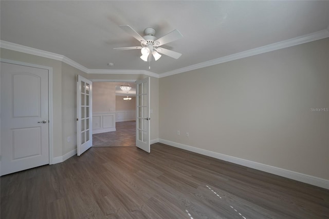 unfurnished bedroom with ceiling fan, dark hardwood / wood-style flooring, crown molding, and french doors