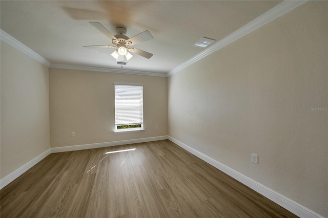 unfurnished room featuring crown molding, ceiling fan, and wood-type flooring