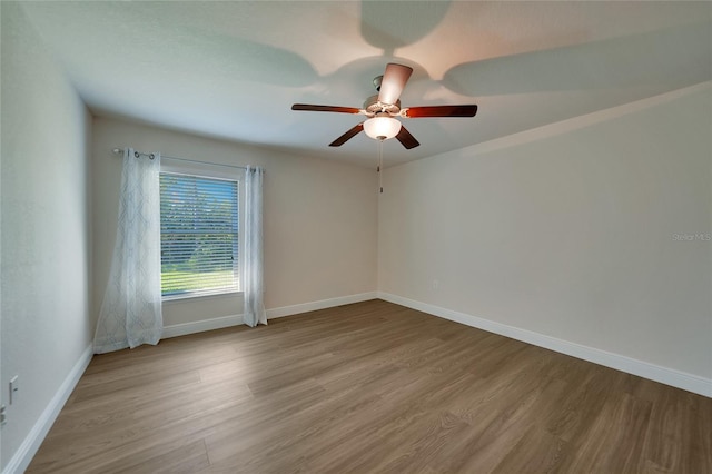 unfurnished room featuring ceiling fan and light hardwood / wood-style flooring