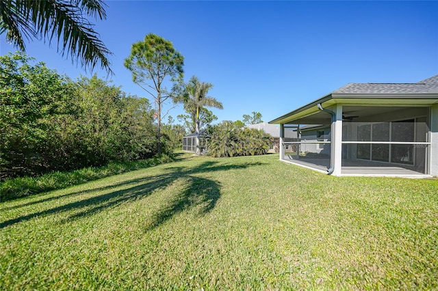 view of yard featuring a sunroom