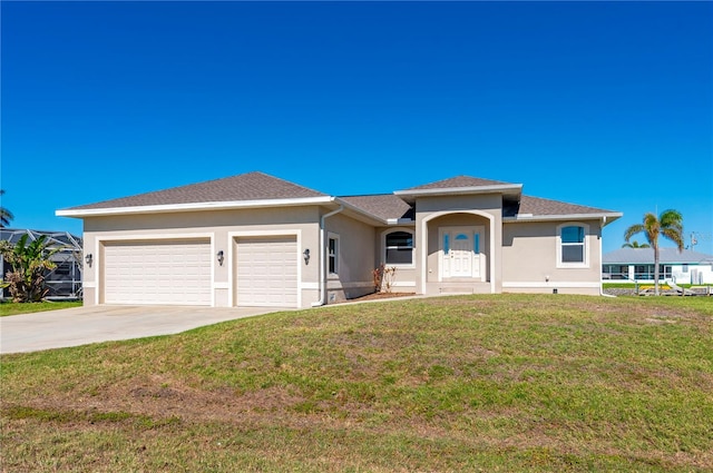 view of front of house featuring a front yard and a garage