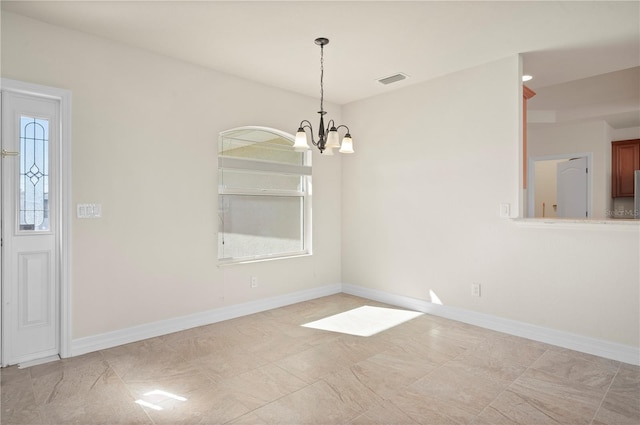 unfurnished dining area with an inviting chandelier and plenty of natural light