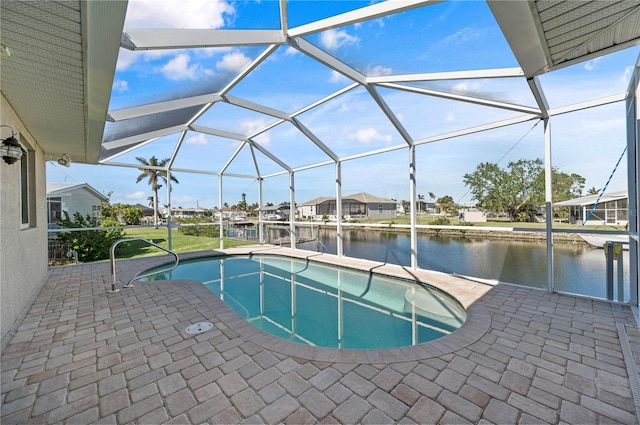 view of pool with glass enclosure, a dock, and a water view