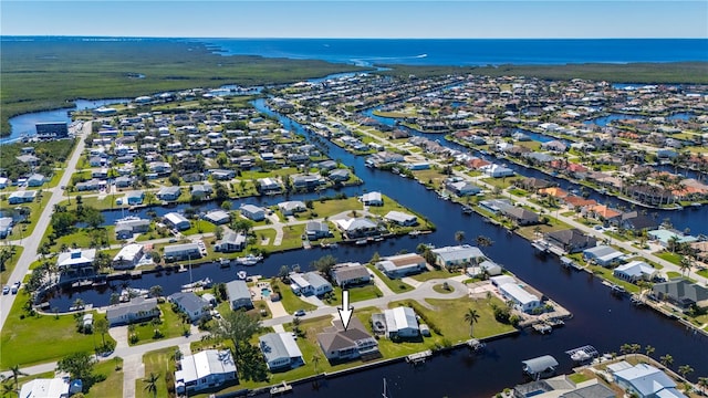 birds eye view of property featuring a water view