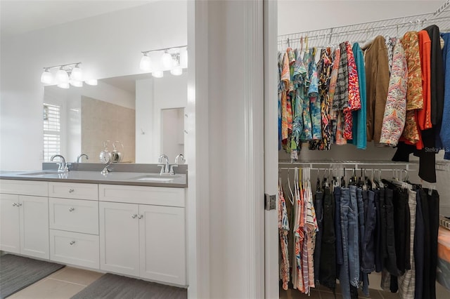 bathroom featuring tile patterned floors and vanity