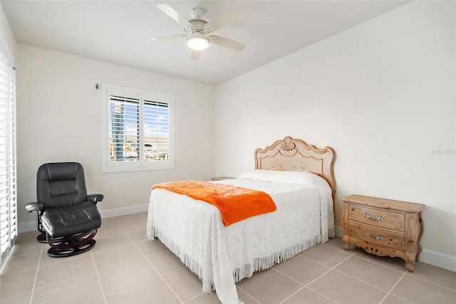 bedroom with ceiling fan and light tile patterned floors