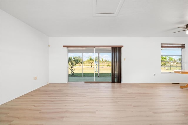 spare room featuring light hardwood / wood-style flooring and ceiling fan