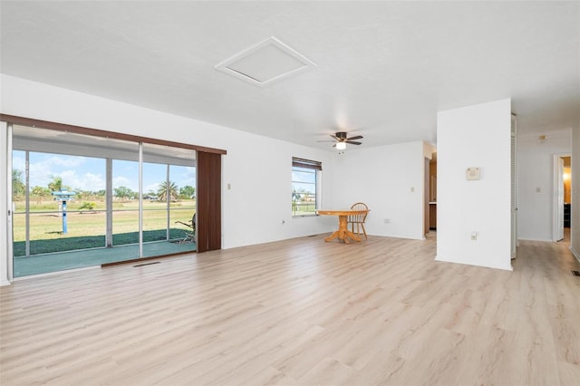 unfurnished living room featuring light hardwood / wood-style floors and ceiling fan