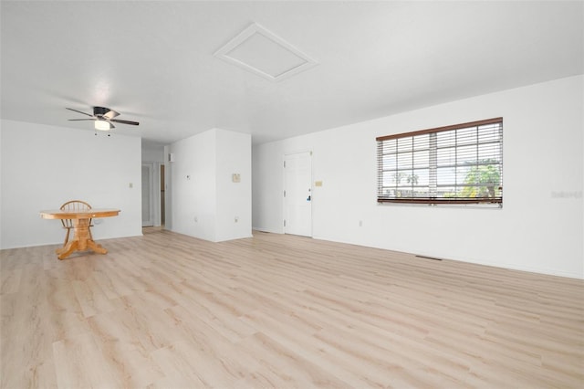 unfurnished living room with ceiling fan and light hardwood / wood-style flooring