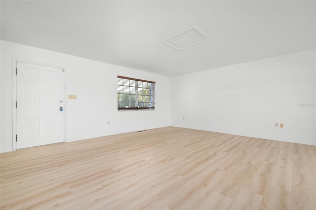 spare room featuring light hardwood / wood-style flooring