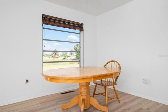 dining room with light wood-type flooring