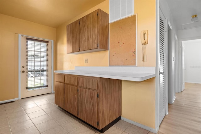 kitchen featuring light tile patterned flooring