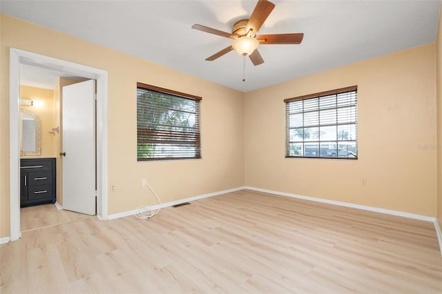 interior space with ceiling fan, light hardwood / wood-style flooring, and a healthy amount of sunlight