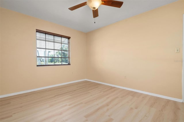 unfurnished room featuring ceiling fan and light wood-type flooring