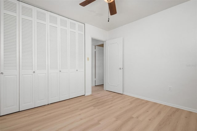 unfurnished bedroom featuring light hardwood / wood-style floors and ceiling fan