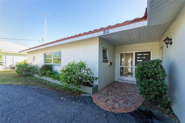 entrance to property with a patio