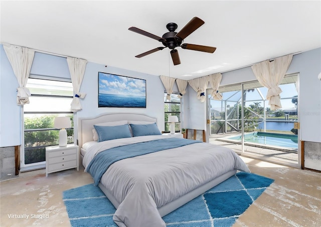 bedroom with concrete floors, access to outside, ceiling fan, and a water view