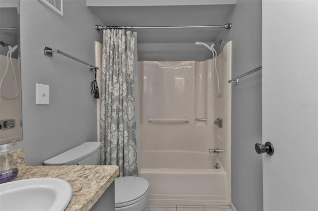 full bathroom featuring shower / bath combo with shower curtain, tile patterned flooring, vanity, and toilet