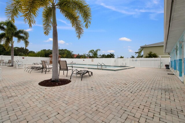 view of patio / terrace featuring a community pool