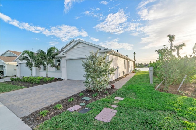 view of home's exterior featuring a garage and a yard