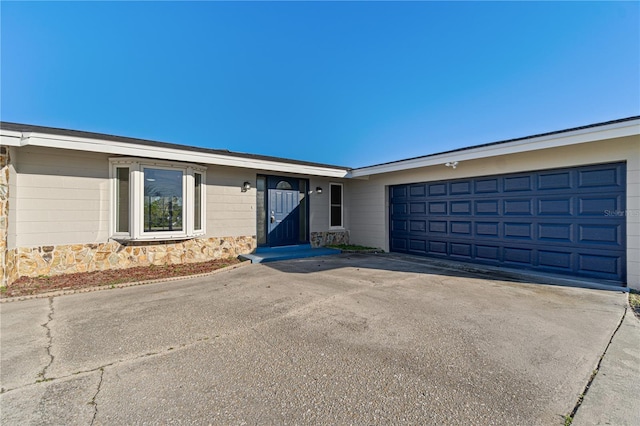 single story home with a garage